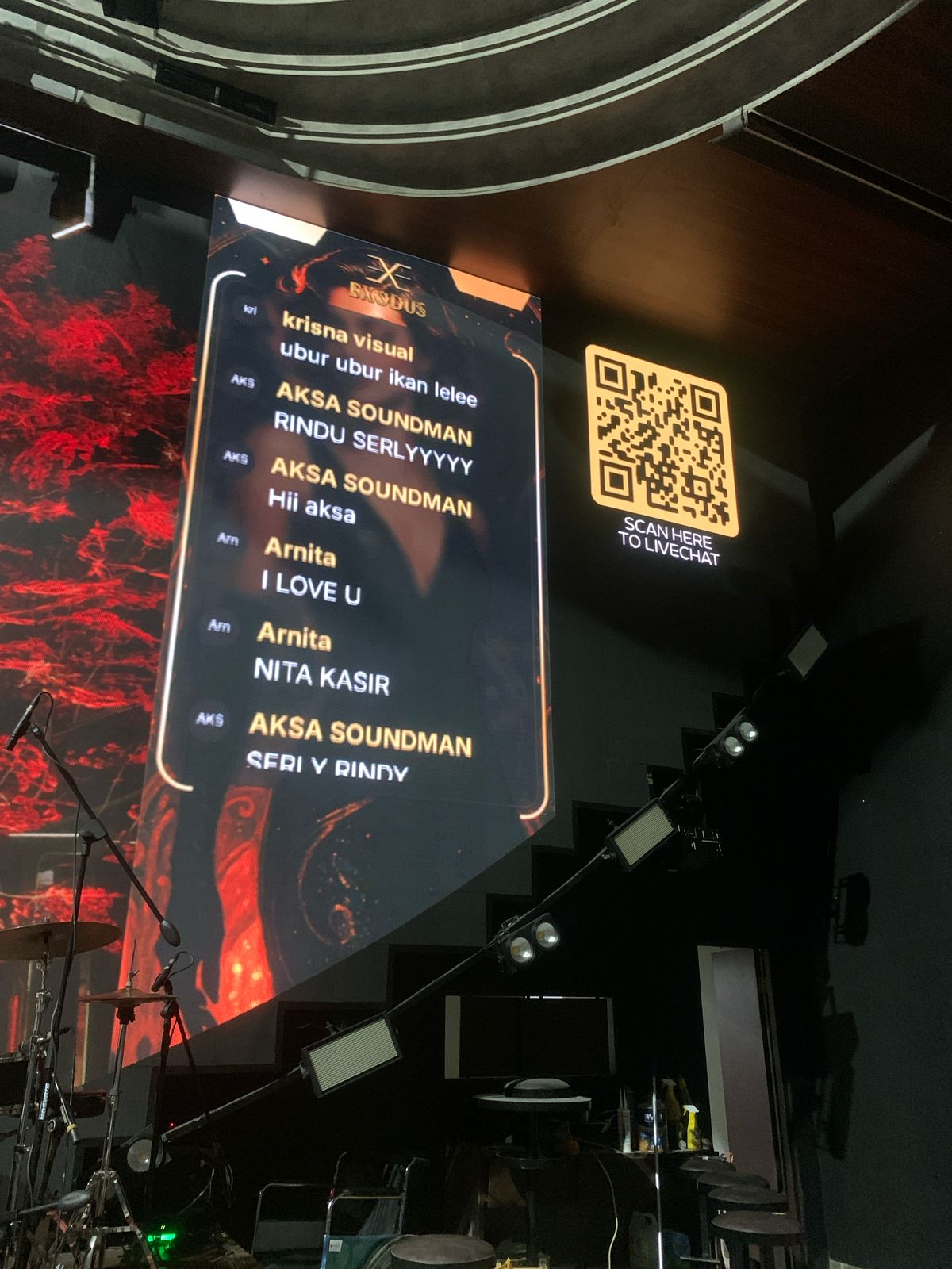 Audience messages and QR code displayed on an event LED screen